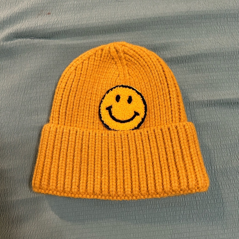 Vibrant Yellow Knit Hat with Smiley Face Design